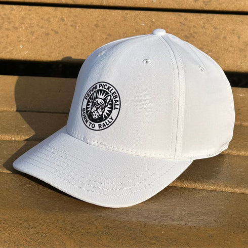 White cap with a logo on a wooden surface